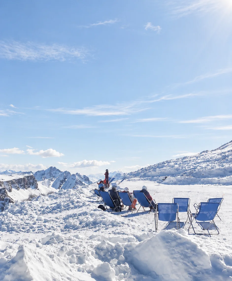 Deckchairs on the snow with mountain views