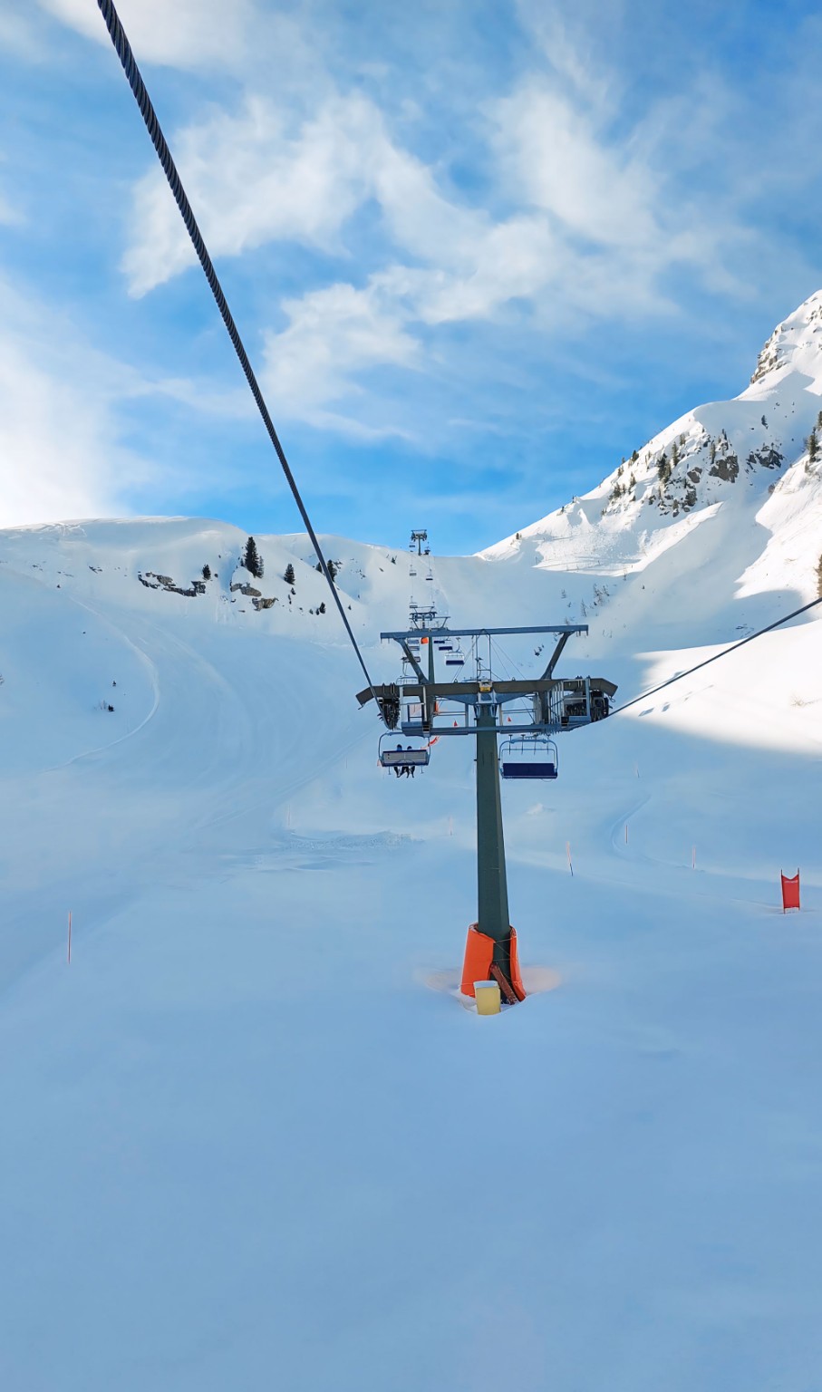 Ski lift over snowy slopes